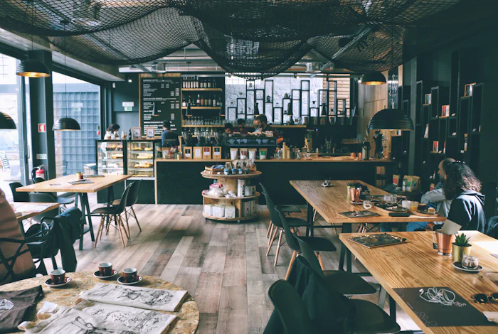 Warm, wood-and-black café interior with a long service counter