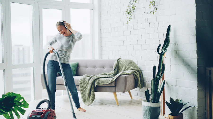 A cleaner vacuuming a bright, tidy room