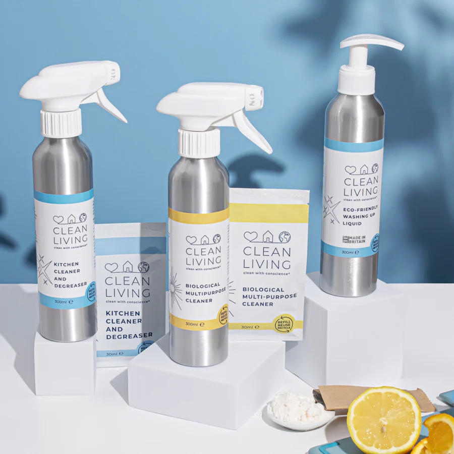 Neatly arranged cleaning supplies: cloths, brushes and spray bottles