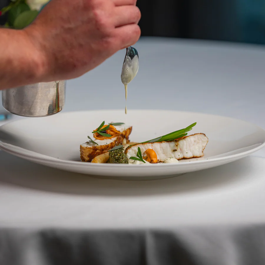 A plated fish dish with vegetables